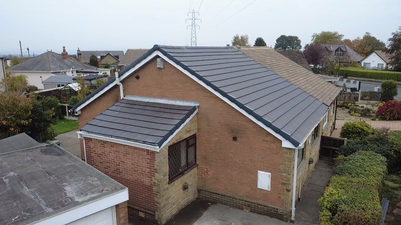 Full re-roof of a Victorian terrace in Horsforth — new tiles being installed