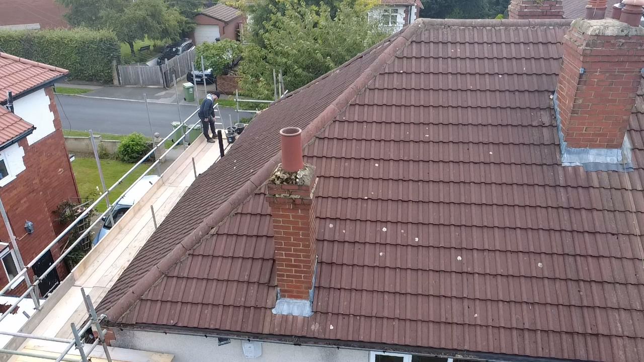 Tiled roof with repaired chimney — aerial view